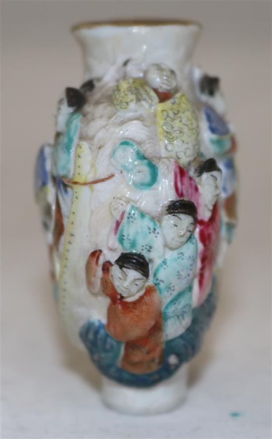 A Chinese famille rose moulded porcelain snuff bottle, Qianlong mark, c.1821-50, height 6.2cm